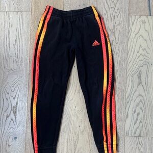 Adidas Kids Black Sweatpants with Red and Orange Accents